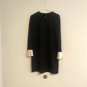 Wednesday-inspired black mini dress with white accordion cuffs